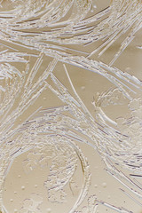 Snow patterns on glass as an abstract background