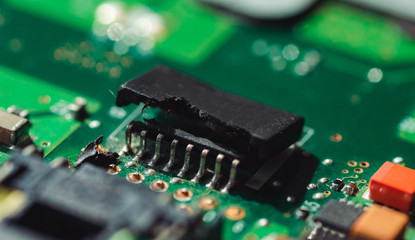 Macro photo of a broken laptop chip close up