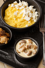 Typical Ukrainian dish polenta - Banosh with cheese and lard. Ukrainian cuisine. maize porridge...