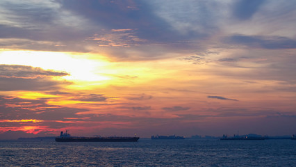 Naklejka na ściany i meble sunset over the sea at Singapore