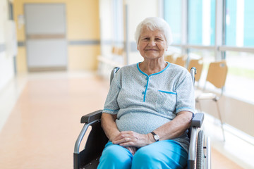 Portrait of an elderly woman sitting in her wheelchair