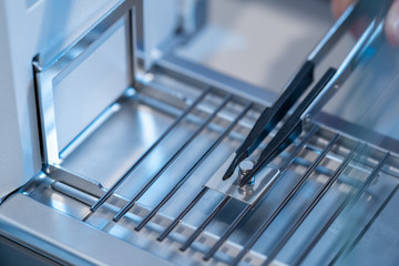 Stainless steel calibration weight to place on the analytical balance for calibration test.