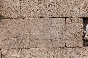 Background of ancient stone wall of a greek temple