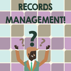 Writing note showing Records Management. Business concept for administration of records and documented information Businessman Raising Both Arms with Question Marks Above Head