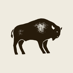 Bison Silhouette Icon. Vector Hand draw bison Symbol of America In Retro style with Grunge Texture on a Light background. Template for logo steak house, farm, t-shirt print and other.