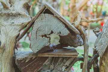 Hand made wooden bird house nest  in public Park , hand wood shelter for birds .