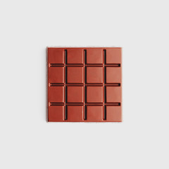 Dark chocolate square shape on a white background from top view. Isolate