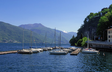 Fototapeta na wymiar sailboats anchored on the Como lake, Italy