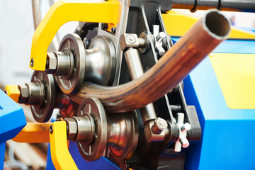 Fototapeta tube bending. industrial bender equipment machine for metal pipe bending. obraz