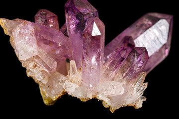 Macro of amethyst mineral stone on black background