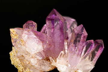 Macro of amethyst mineral stone on black background