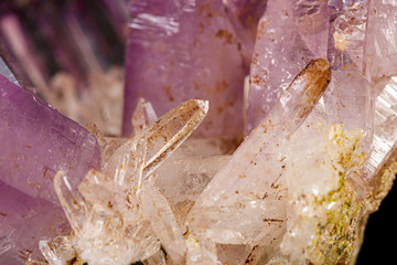 Macro of amethyst mineral stone on black background