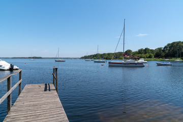 Quiet boat pontoon on Lacanau Lake in Gironde France