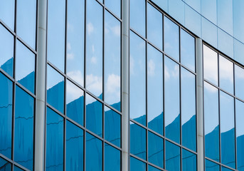 abstract background reflected in the glass windows of the building