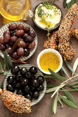  Lebanese  cheese cream dip with olive oil , bread and olives.Top view