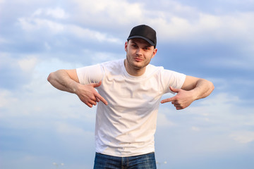 Naklejka premium Charismatic man in a white T-shirt. Advertising Banner Fashion and Style. Mockup.Copyspace