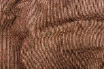 clothing items stonewashed cotton fabric texture with seams, clasps, buttons and rivets, macro