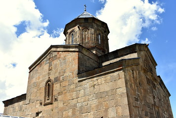 Fototapeta na wymiar View of Gergeti Trinity Church in the Caucasus mountains, Georgia