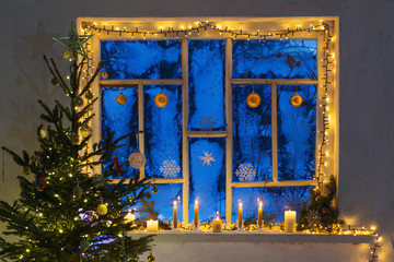 Christmas decorations on old wooden window