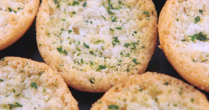 Slices of tasty garlic bread with herbs