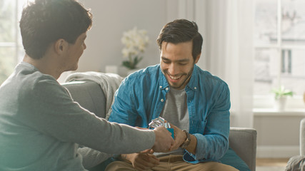 Adorable Gay Boyfriend Gifts a Beautiful Shiny Gift Box to His Cute Hispanic Fiance. Surprised...