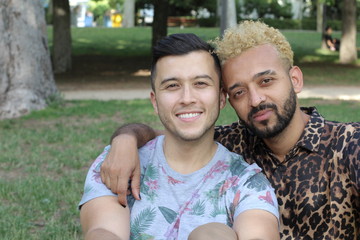 Ethnic gay couple in the park 