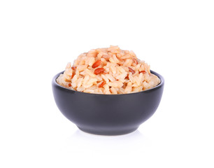 Rice brown in a bowl on white background