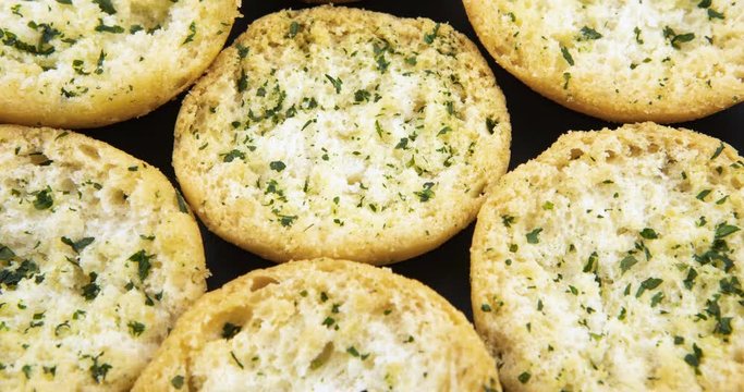Slices of tasty garlic bread with herbs