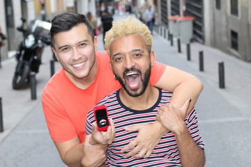 Ethnic gay couple getting engaged