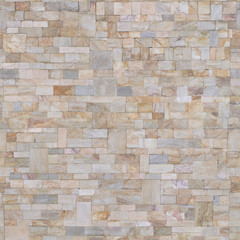 Tiles on the wall are made of different pieces .Background or texture
