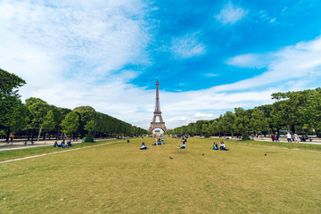 Paris, France - circa May, 2017: Eiffel Tower and tourist people relaxing et Champ de Mars in...