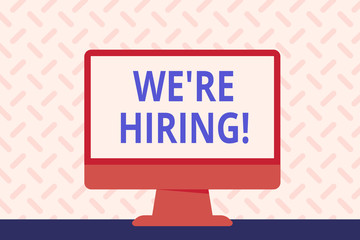 Text sign showing We Re Hiring. Business photo showcasing recently employ someone or pay him to do particular job Blank Space Desktop Computer Colorful Monitor Screen Freestanding on Table