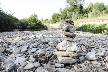 Fototapeta na wymiar stone tower on a mountain river