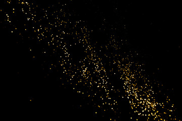 Gold abstract bokeh. Black background. Holyday concept
