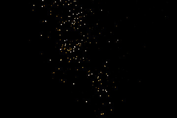 Gold abstract bokeh. Black background. Holyday concept