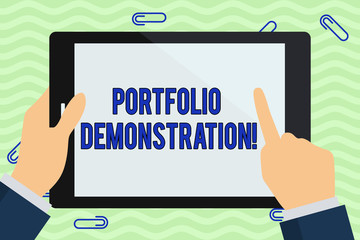 Writing note showing Portfolio Demonstration. Business concept for range of investments held by demonstrating or organization Hand Holding Pointing Touching Color Tablet White Screen