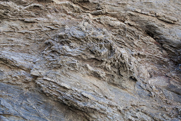 Textura de pedra natural. Superfície texturizada de rocha natural, onde se podem ver as linhas desenhadas na rocha ao longo do tempo. Pode ser usada como fundo.