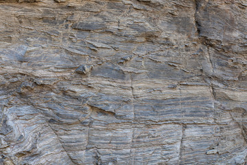 Textura de pedra natural. Superfície texturizada de rocha natural, onde se podem ver as linhas desenhadas na rocha ao longo do tempo. Pode ser usada como fundo.