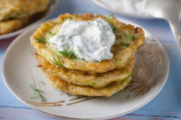 Pancakes from zucchini. Vegetarian vegetable patties or pancakes.