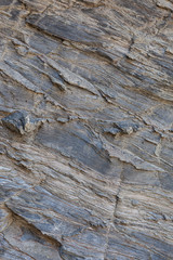 Textura de pedra natural. Superfície texturizada de rocha natural, onde se podem ver as linhas desenhadas na rocha ao longo do tempo. Pode ser usada como fundo.