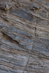 Textura de pedra natural. Superfície texturizada de rocha natural, onde se podem ver as linhas desenhadas na rocha ao longo do tempo. Pode ser usada como fundo.