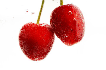 red and ripe cherries with drink bubbles