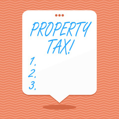 Conceptual hand writing showing Property Tax. Concept meaning bills levied directly on your property by government White Speech Balloon Floating with Three Punched Hole on Top