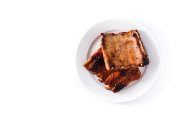 Grilled barbecue ribs isolated on white background. Top view. Copyspace