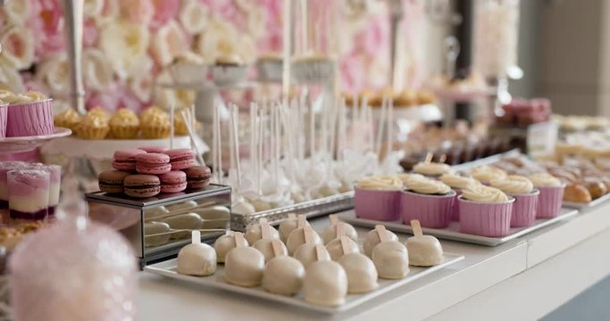 Cute candy bar with various cakes and candies. Wedding candybar.