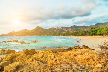 Tropical bungalows on rock beach
