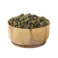 Fototapeta na wymiar heap of green peppercorn in wooden cup isolated on white background