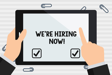 Handwriting text We Re Hiring Now. Conceptual photo recently employ someone or pay someone to do particular job Hand Holding Pointing Touching Blank Rectangular Color Tablet White Screen