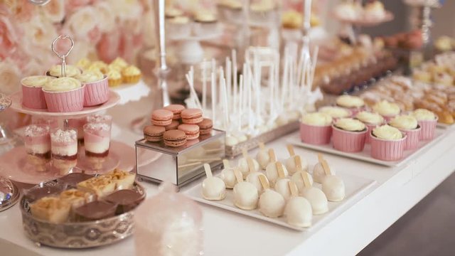 Cute candy bar with various cakes and candies. Wedding candybar.