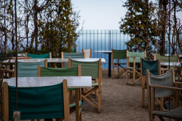 Summer restaurant terrace on shore with sea views